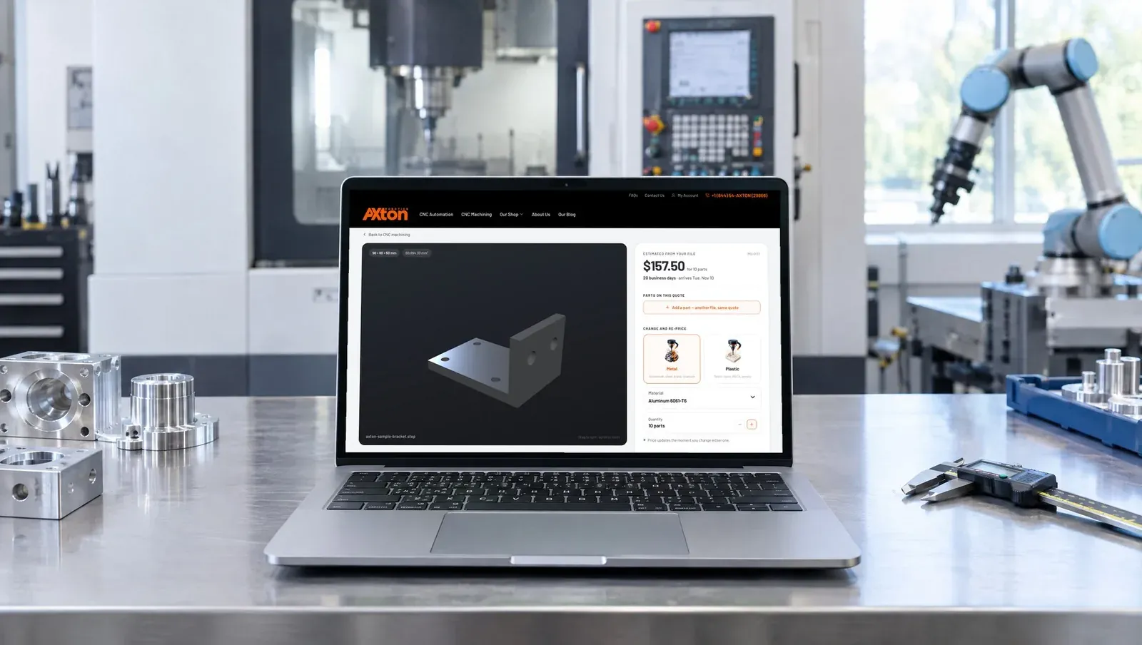Laptop in a machine shop showing the Axton quote screen with a 3D bracket and a price of $157.50 for 10 parts
