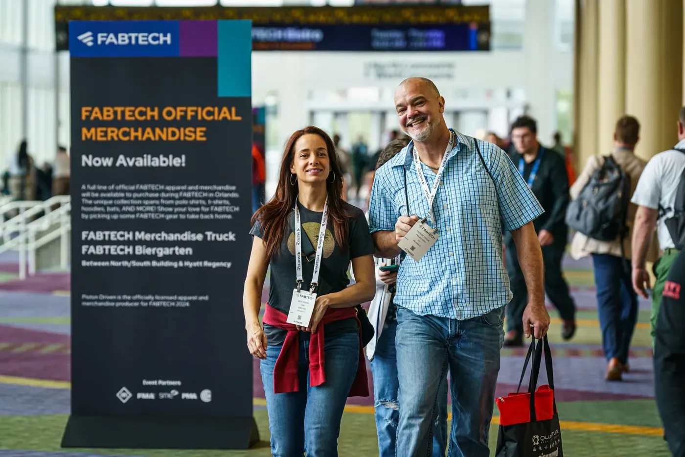 Attendees walking the FABTECH show