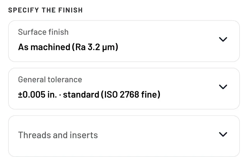 Specify the finish panel with surface finish as machined Ra 3.2 µm, general tolerance ±0.005 in. and threads and inserts